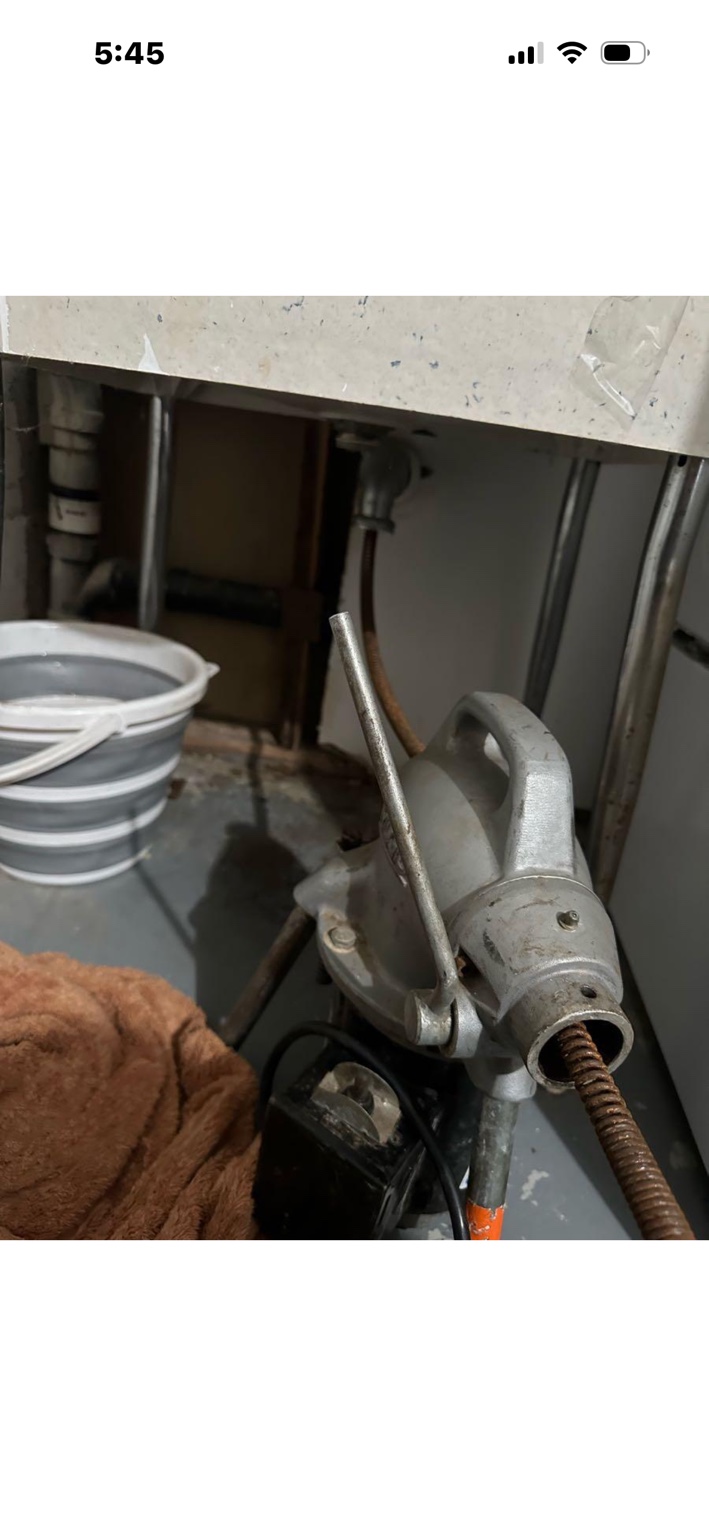 Drain cleaning in progress